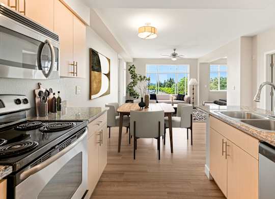 A modern kitchen with a dining table and chairs.