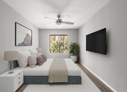 A bedroom with a bed, nightstand, and a painting on the wall.