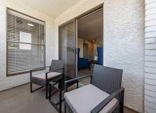 A patio with a table and chairs is shown.