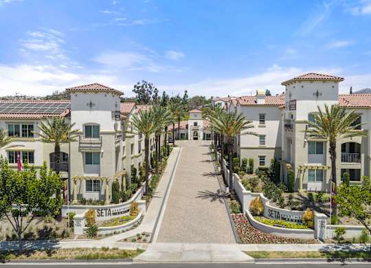 A row of houses with a sign that says SETA.