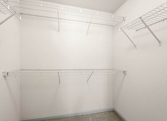 Empty white shelving unit in a room.
