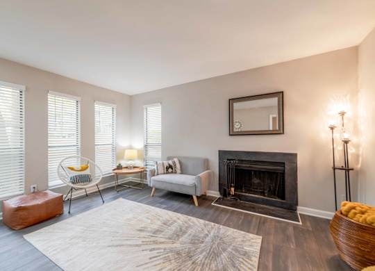 A living room with a fireplace and a couch.