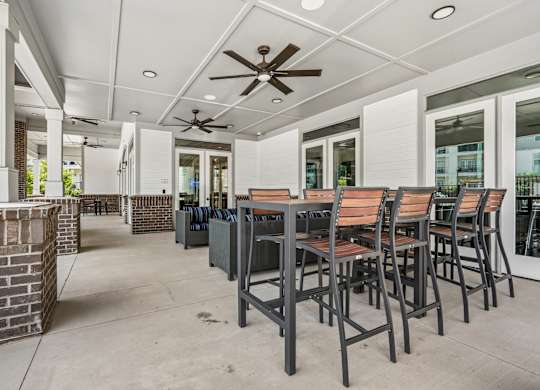 A patio with a table and chairs is shown.