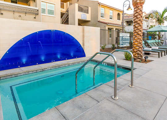 A swimming pool with a blue tinted cover.