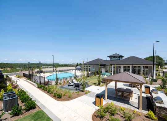 an aerial view of a building with a swimming pool