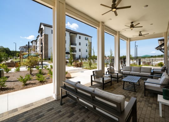 the preserve at ballantyne commons covered patio with couches and tables
