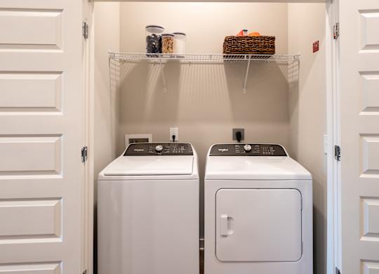 a washer and dryer in a small laundry room