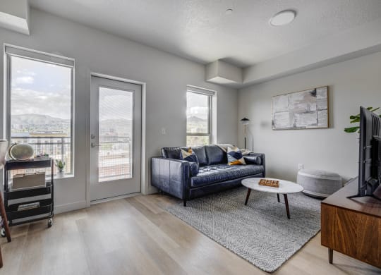 an open living room with a couch and a tv