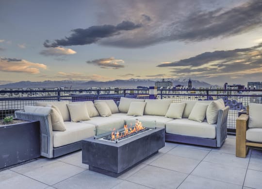 patio has a view of the city and the mountains in the background
