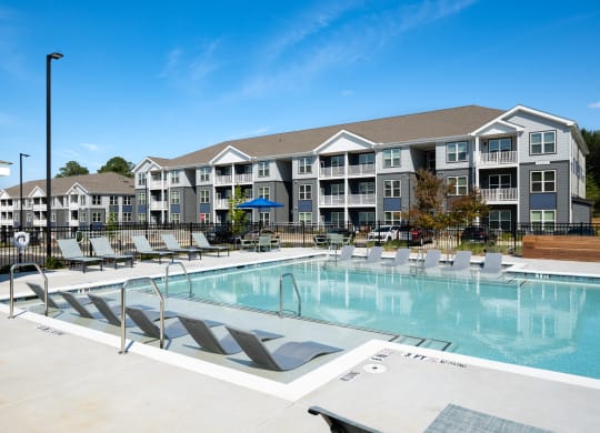 the preserve at ballantyne commons community swimming pool with apartment buildings