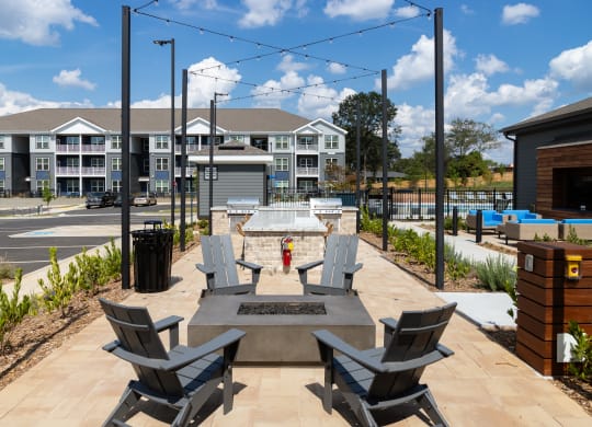 an outdoor patio with chairs and a fire hydrant