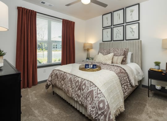 the preserve at ballantyne commons bedroom with large bed and windows