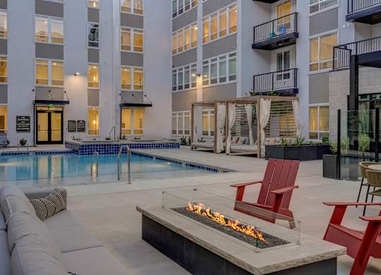 A fire pit sits in the middle of a patio.