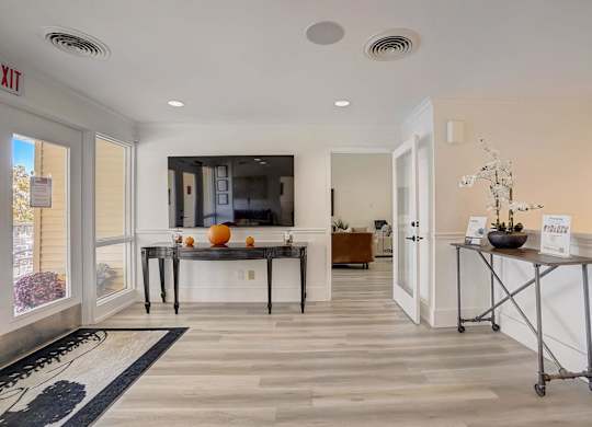 A reception area with a desk and a chair.