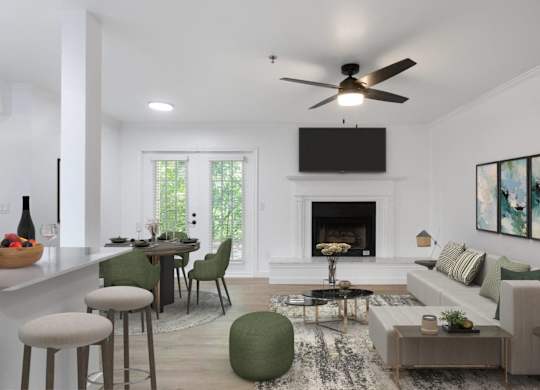 A modern living room with a fireplace and a flat screen TV mounted above it.