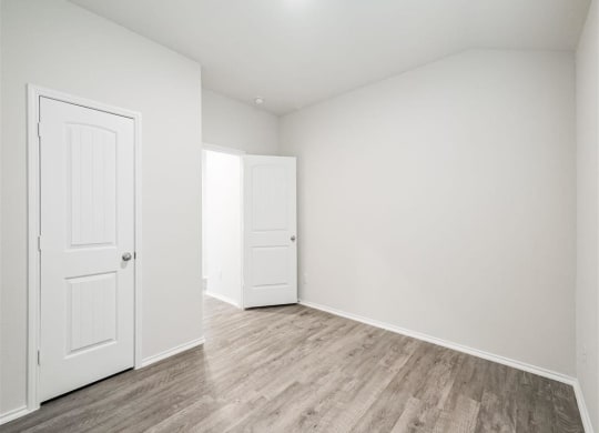 Contemporary Finishes Include Wood And Tile Floorin at The Village at Caney Mills, Conroe, TXg