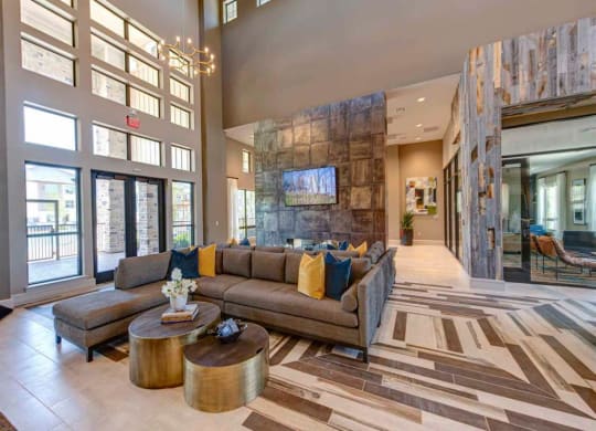 a large living room with a couch and a table