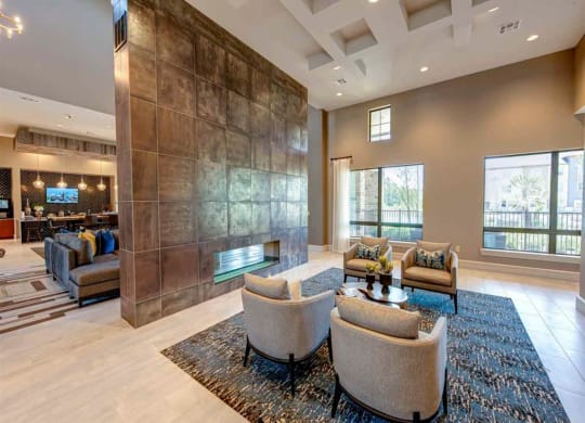a living room with couches and chairs and a fireplace