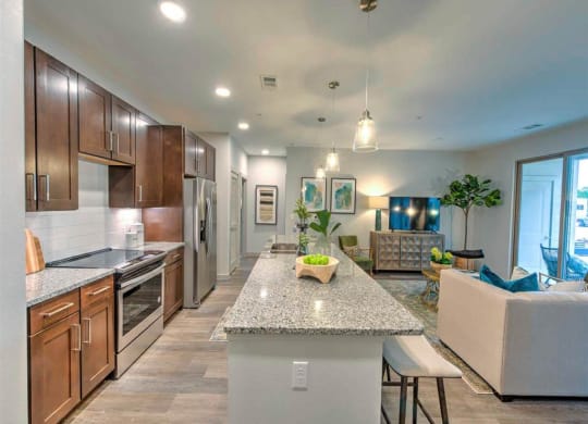 a kitchen and living room with a counter top