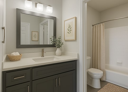 A bathroom with a white toilet and a white sink.