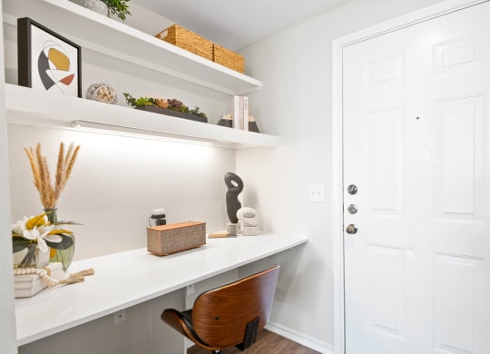 a home office with a desk and a white door at Mission Gate, Plano, TX
