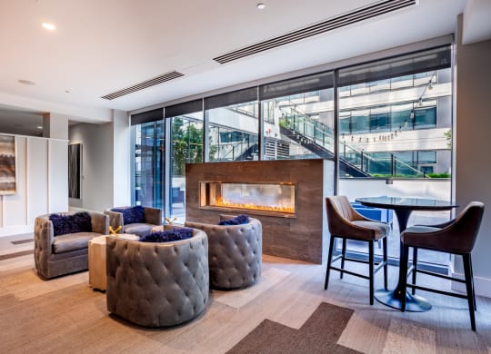 Community Lounge Space with Seating and Fireplace at The Grand Central Apartments in Chicago, IL 60607