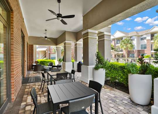Outdoor Patio Area at Madison on the Meadow Apartments in Stafford, TX 77477