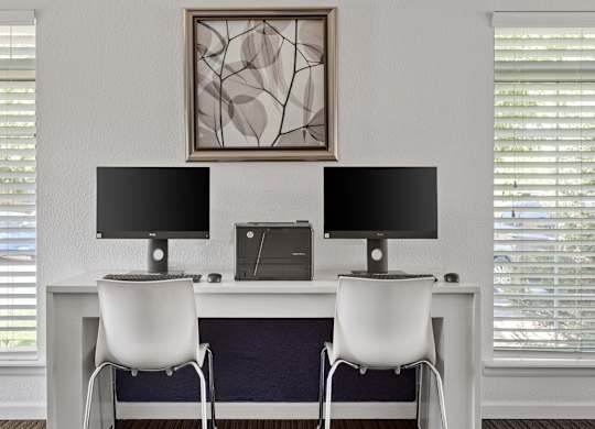 a white desk with two monitors and two chairs  at Verona, Littleton, Colorado