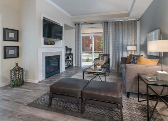 A living room with a fireplace, a couch, and a coffee table.
