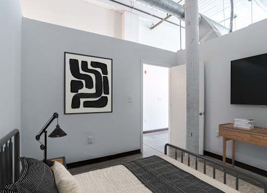 Chic bedroom at Highland Mill Lofts in Charlotte, NC