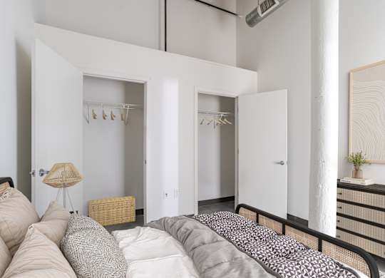Bedroom with Walk-In Closet at Highland Mill Lofts in Charlotte, North Carolina 28205