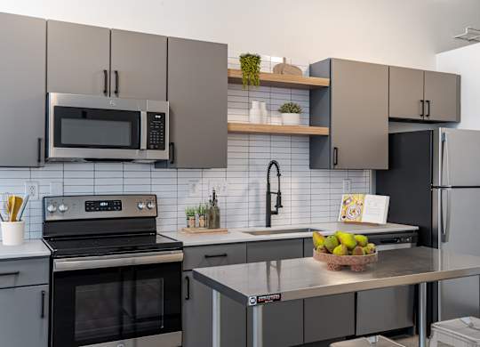 Kitchen with Stainless Steel Appliances  at Highland Mill Lofts in Charlotte, NC