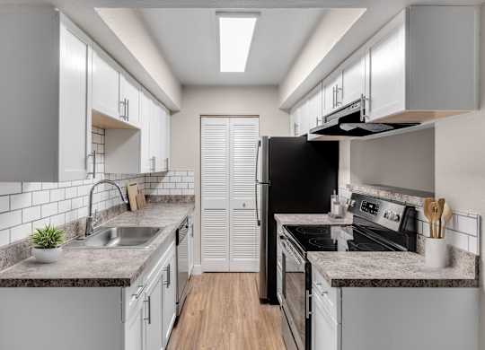 Kitchen with plenty of storage at Verona Apartments in Littleton, CO