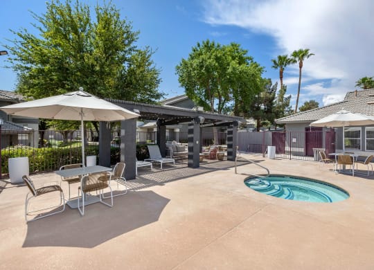 our apartments have a pool and patio with umbrellas  at Paisley and Pointe Apartments, Las Vegas, 89130