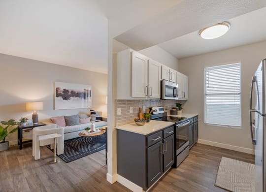 our apartments at the district feature a spacious kitchen and living room at Paisley and Pointe Apartments, Las Vegas, Nevada
