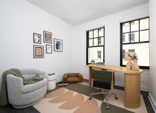 a home office with a chair and a desk and a window  at The Belden Stratford, Illinois, 60614