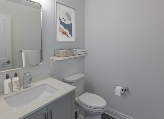 a bathroom with a toilet and a sink and a mirror at The Belden Stratford, Chicago, IL, 60614