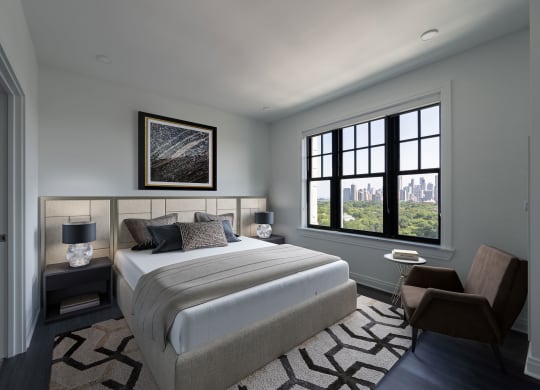 a bedroom with a bed and a window  at The Belden Stratford, Illinois