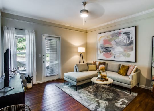 a living room with a couch and a table at Carrington at Barker Cypress, Texas, 77433