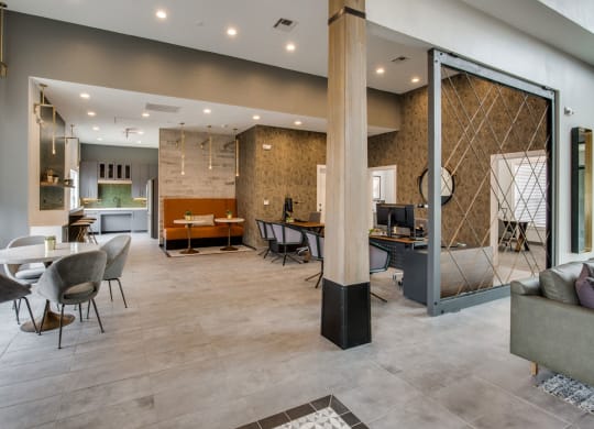 the lobby with tables and chairs at Carrington at Barker Cypress, Cypress, TX, 77433