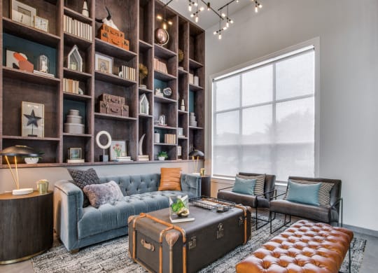 a living room filled with furniture and a large window at Carrington at Barker Cypress, Cypress, TX