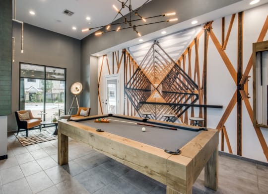 a pool table in the resident lounge at Carrington at Barker Cypress, Texas, 77433