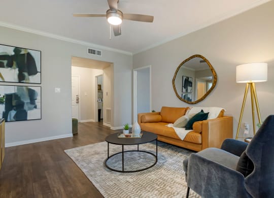 a living room with a couch and a coffee table at Madison on the Meadow, Stafford, Texas