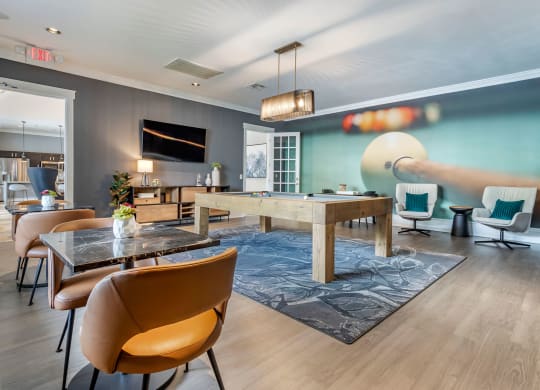 a living room with a dining room table and chairs at Reserve by the Lake, Texas