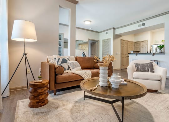 a living room with couches and a coffee table at Reserve by the Lake, Houston