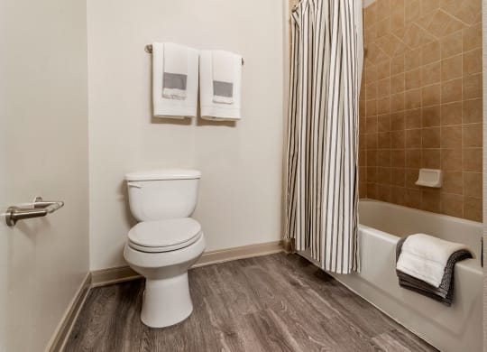 an image of a bathroom with a toilet and a bath tub at Reserve by the Lake, Houston, TX, 77084