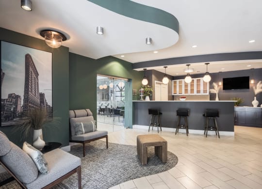 a lobby with tables and chairs and a bar at 15 Bank Apartments, White Plains, NY