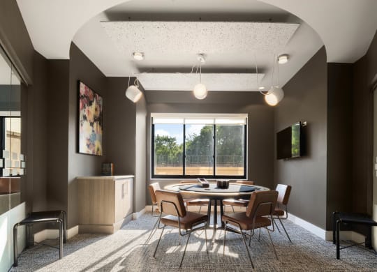 a conference room with a table and chairs and a window at 15 Bank Apartments, White Plains