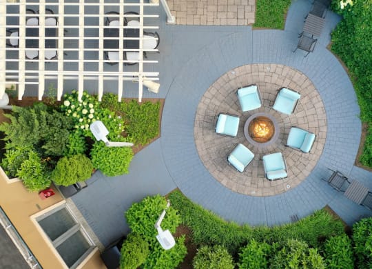 a courtyard with chairs and a fire pit at 15 Bank Apartments, White Plains, NY, New York