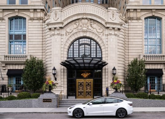 a white car parked in front of a building  at The Belden Stratford, Chicago, Illinois